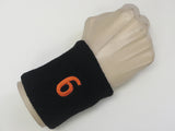 Black wristband sweatband with number 6 six