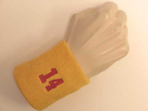 Golden yellow wristband sweatband with number 14