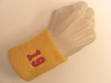 Golden yellow wristband sweatband with number 19