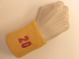 Golden yellow wristband sweatband with number 20