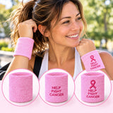 Three light pink terry cloth wristbands: plain, text only, and pink ribbon with text