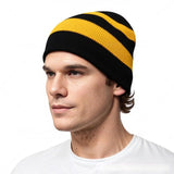 Black and gold striped knit beanie worn on model