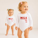 Toddlers wearing milk bottle graphic bodysuits
