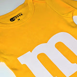 M&M print baby onesie back view