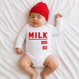 Baby wearing milk bottle graphic bodysuit with red cap