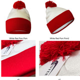 Close-up of white beanie with red ribbed cuff and red pom-pom