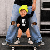 Skeleton bodysuit outfit with beanie and checkered socks on a skateboard