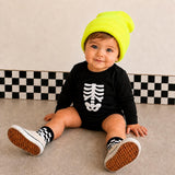 Skeleton bodysuit styled with beanie, checkered socks and canvas sneakers