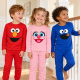 Three long-sleeve tees with cartoon face graphics in red, pink and blue