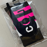 Black socks with neon pink stripes in a clear bag